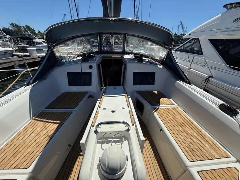 Slide: The Image of 2021 Jeanneau Sun Odyssey 410 sailboat cockpit with teak flooring, docked at marina. - 4