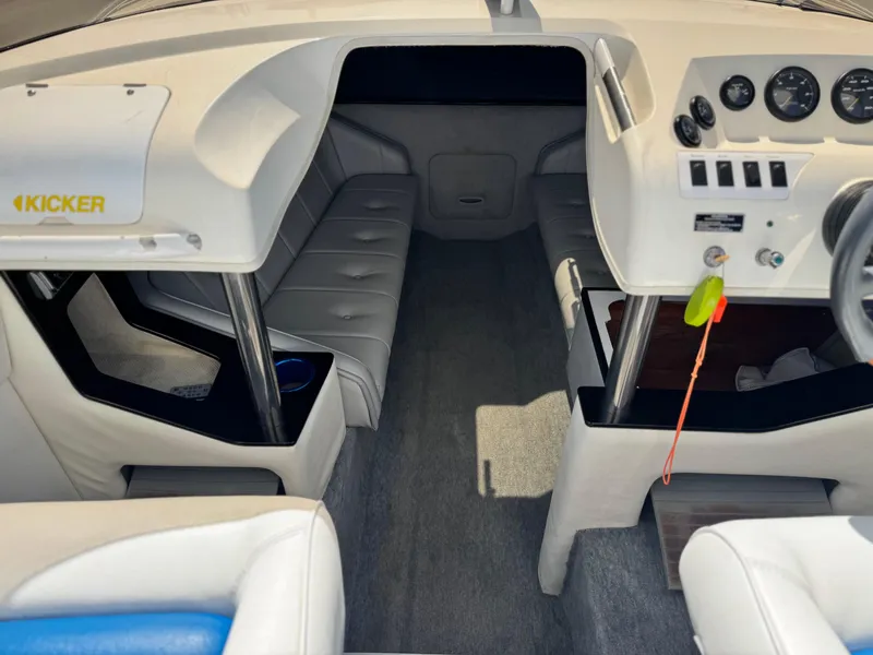 Slide: The Image of Interior of a 1998 Nordic 25 Scandia boat with seating and dashboard. - 11