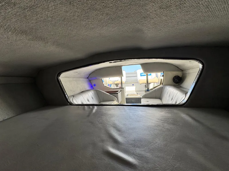 Slide: The Image of Interior view of a 1998 Nordic 25 Scandia boat, showcasing seating and cabin layout. - 15