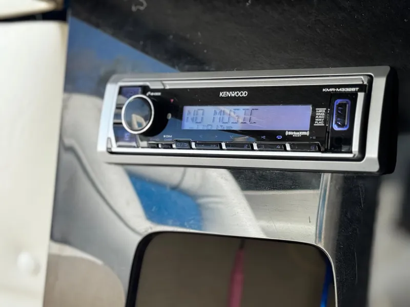 Slide: The Image of Kenwood stereo system in a 1998 Nordic 25 Scandia boat, displaying "No Music". - 17