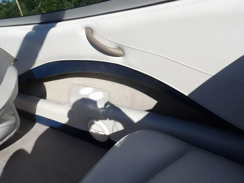 Slide: The Image of Interior of 2004 Crownline 202BR boat with cup holders and speaker. - 11