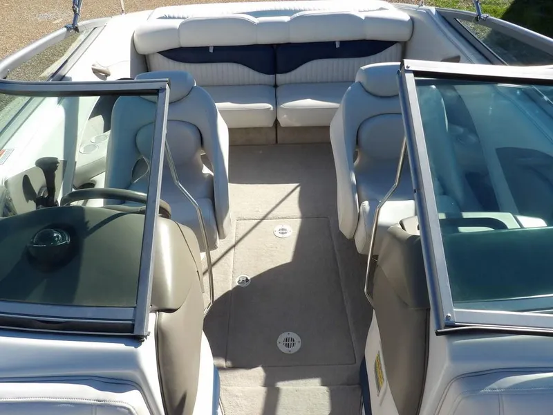 Slide: The Image of 2004 Crownline 202BR boat interior with seating and windshield. - 18
