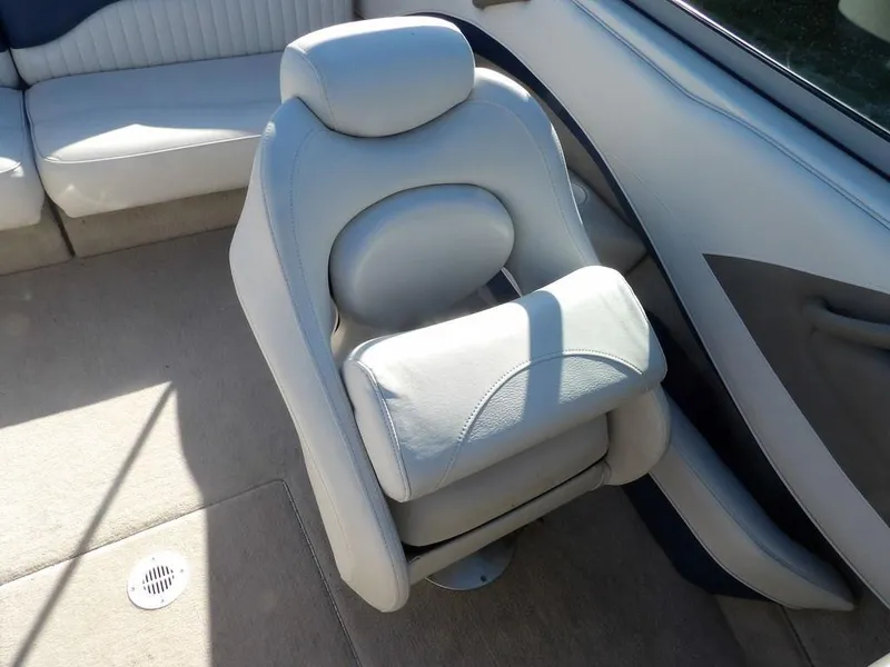 Slide: The Image of 2004 Crownline 202BR boat interior with plush seating and modern design. - 24