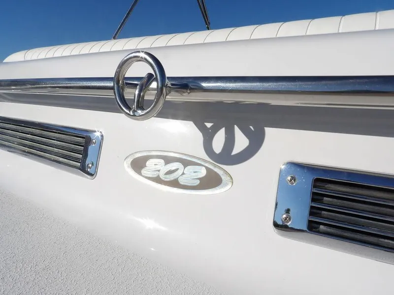 Slide: The Image of 2004 Crownline 202BR boat detail with chrome accents and model emblem. - 30