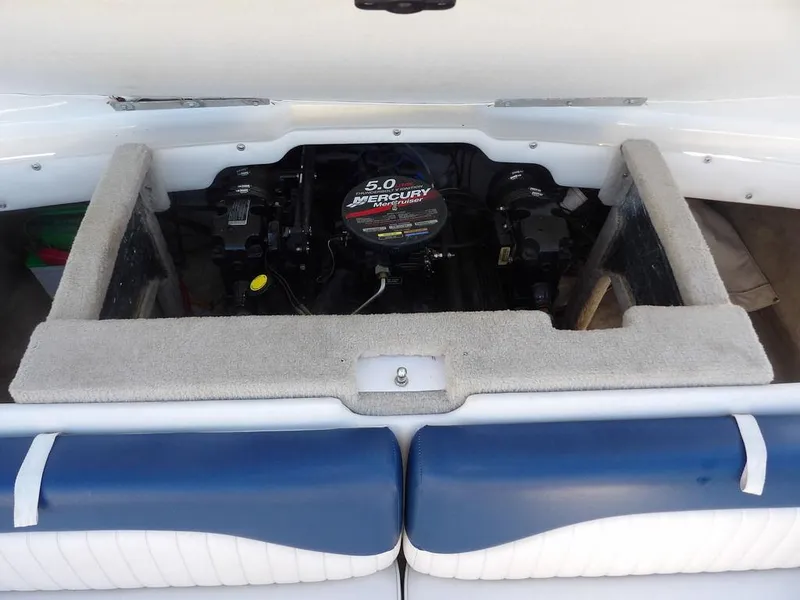 Slide: The Image of 2004 Crownline 202BR boat engine compartment with 5.0 Mercury MerCruiser engine. - 31