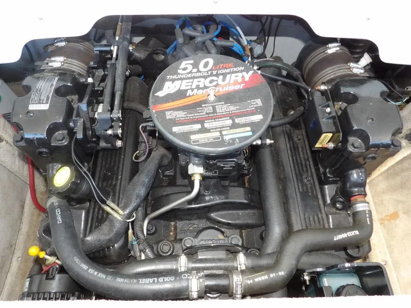 Slide: The Image of 2004 Crownline 202BR boat engine, featuring a 5.0L Mercury MerCruiser with Thunderbolt ignition system. - 33