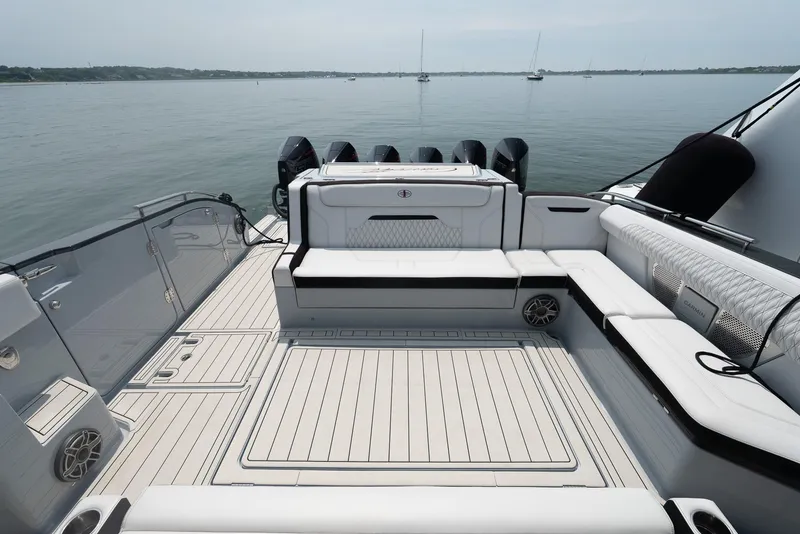 Slide: The Image of Luxurious 2025 Cigarette 52 Thunder yacht deck with sleek seating and powerful engines. - 10