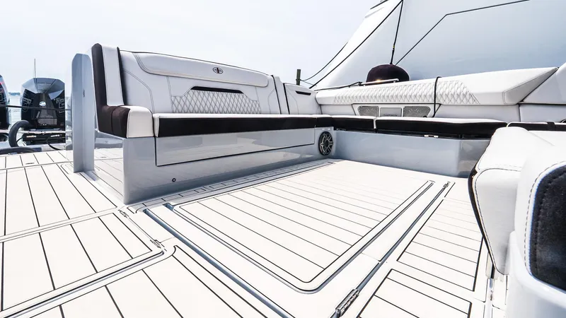 Slide: The Image of Luxury seating on 2025 Cigarette 52 Thunder boat deck, featuring sleek design and modern upholstery. - 12