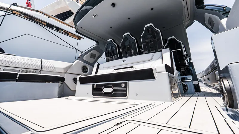 Slide: The Image of Luxurious interior of 2025 Cigarette 52 Thunder yacht, featuring sleek seating and modern design. - 16