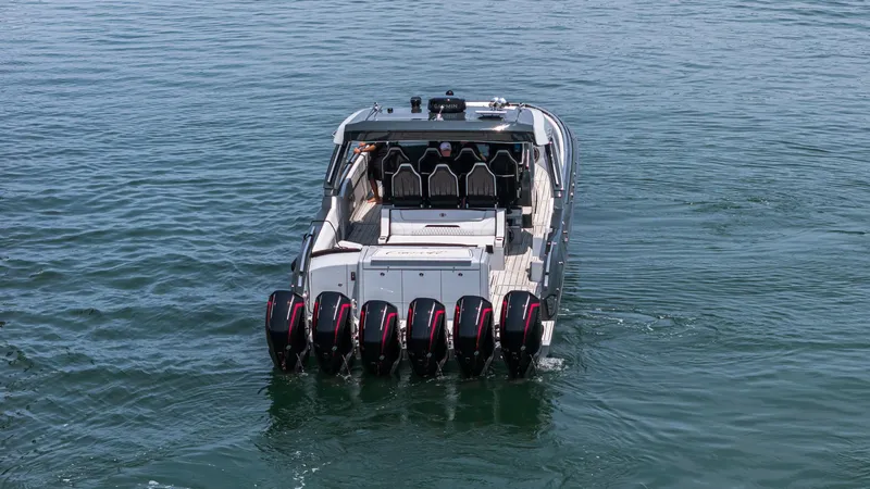 Slide: The Image of 2025 Cigarette 52 Thunder boat with multiple engines on open water. - 2