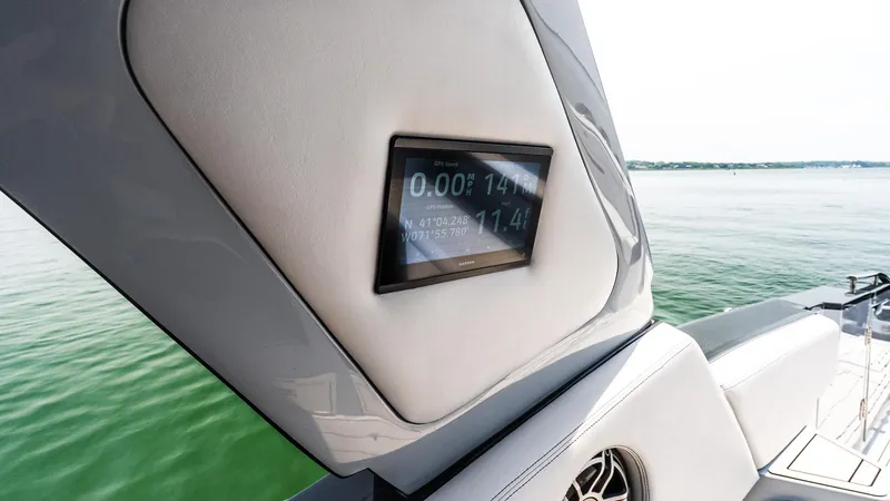 Slide: The Image of Cigarette 52 Thunder 2025 boat with GPS display, sleek design, and scenic water view. - 20
