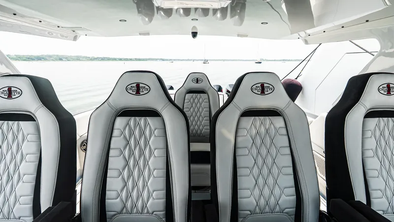 Slide: The Image of Luxury seating on 2025 Cigarette 52 Thunder boat, featuring sleek design and premium materials. - 22