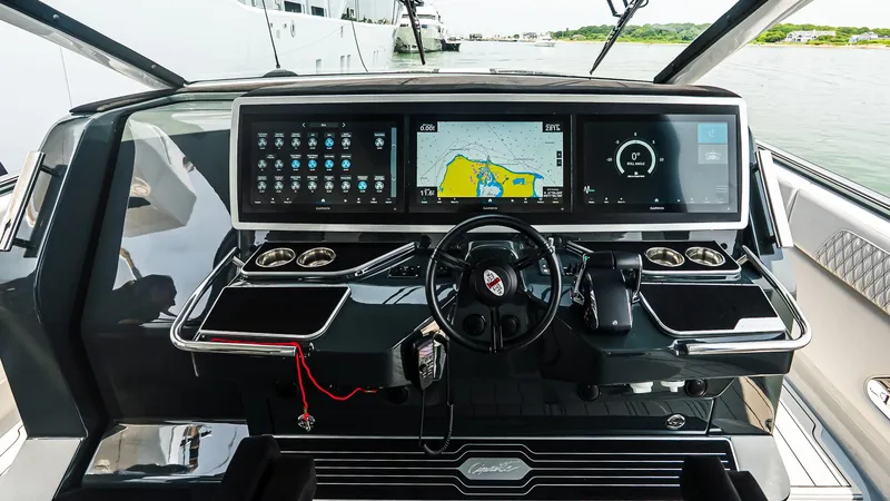 Slide: The Image of Cockpit of 2025 Cigarette 52 Thunder boat with advanced navigation displays and controls. - 29