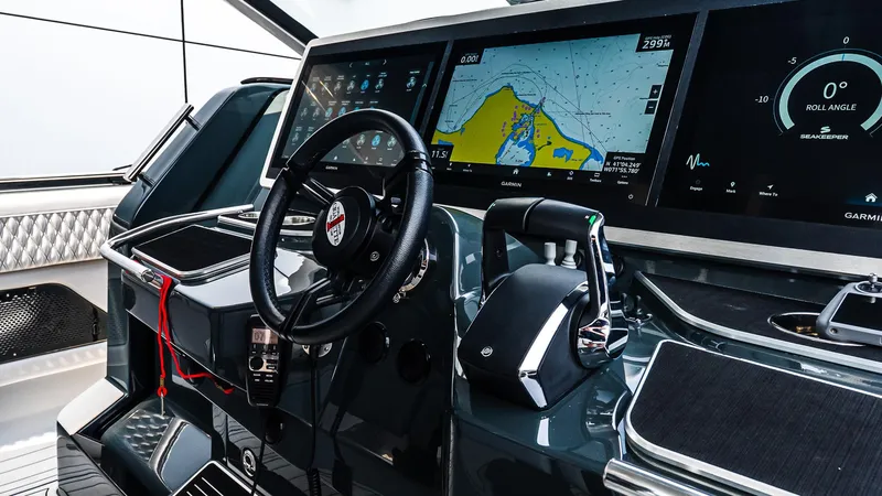 Slide: The Image of 2025 Cigarette 52 Thunder yacht cockpit with advanced navigation displays and controls. - 30