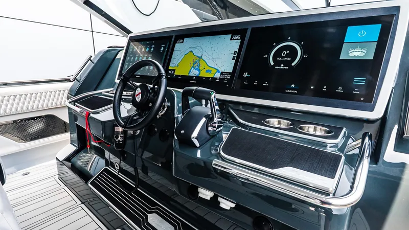 Slide: The Image of 2025 Cigarette 52 Thunder boat dashboard with advanced navigation and control systems. - 31