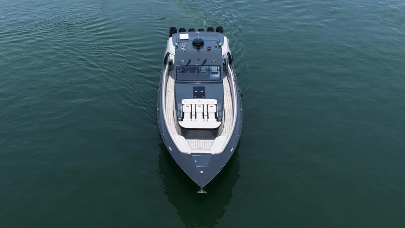 Slide: The Image of 2025 Cigarette 52 Thunder boat on calm water, aerial view. - 4