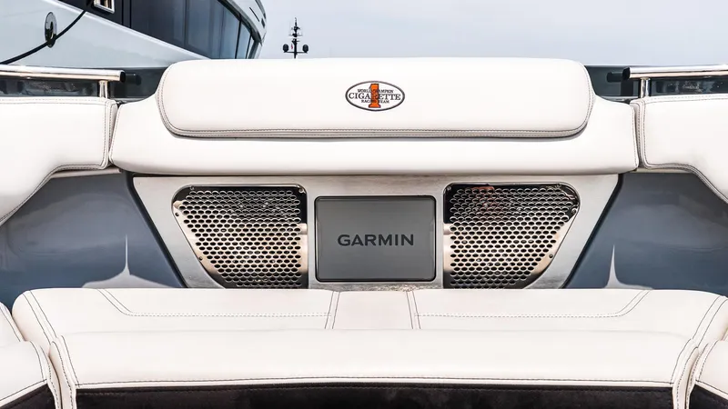 Slide: The Image of 2025 Cigarette 52 Thunder boat interior with Garmin technology and sleek white seating. - 40