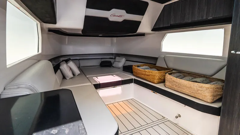 Slide: The Image of Interior of 2025 Cigarette 52 Thunder boat, featuring modern seating and storage baskets. - 41
