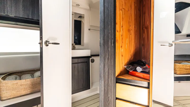 Slide: The Image of Interior of 2025 Cigarette 52 Thunder boat featuring modern cabinetry and storage. - 42