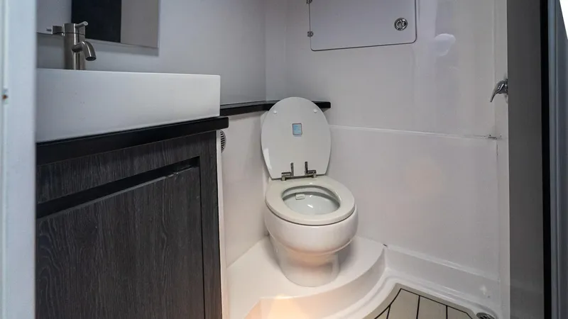 Slide: The Image of Modern bathroom in 2025 Cigarette 52 Thunder boat, featuring sleek sink and toilet design. - 43