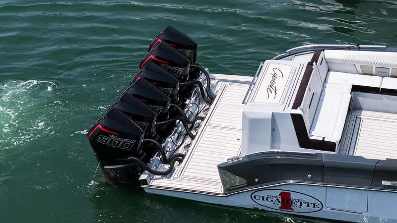 Slide: The Image of 2025 Cigarette 52 Thunder boat with multiple powerful outboard engines on water. - 5