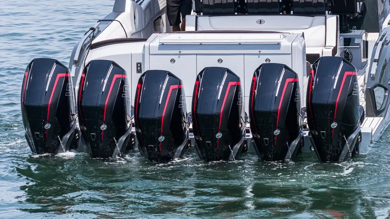 Slide: The Image of 2025 Cigarette 52 Thunder boat with six powerful outboard engines on water. - 6