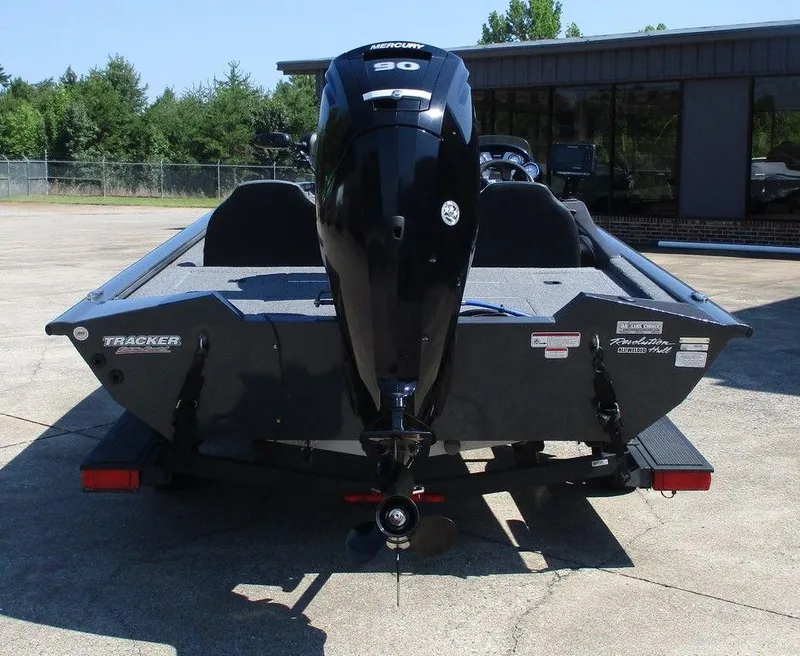 Slide: The Image of 2021 Tracker Pro Team™ 190 TX boat with Mercury 90 engine, parked outdoors. - 3