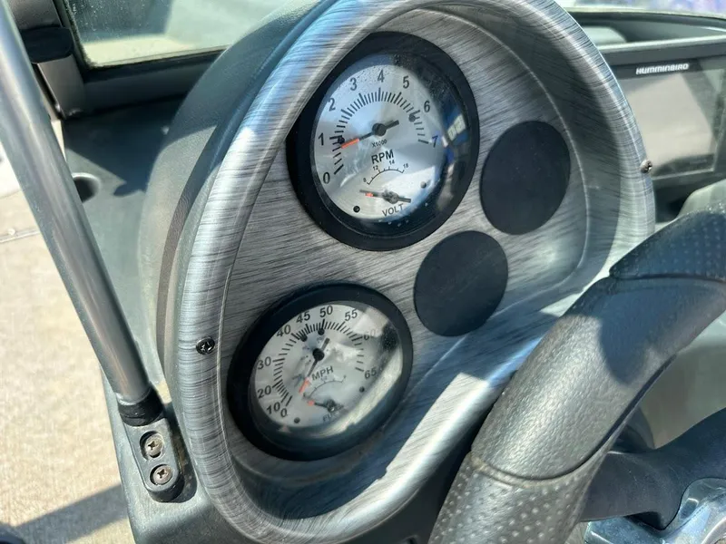 Slide: The Image of Dashboard of 2015 Alumacraft Competitor 165 Sport boat showing RPM and speed gauges. - 16