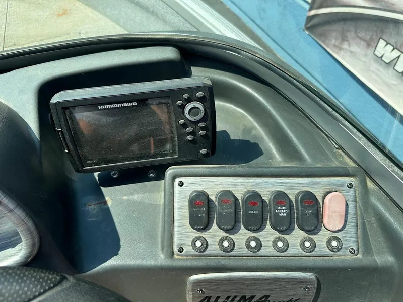 Slide: The Image of Control panel of a 2015 Alumacraft Competitor 165 Sport boat with Humminbird fish finder. - 17