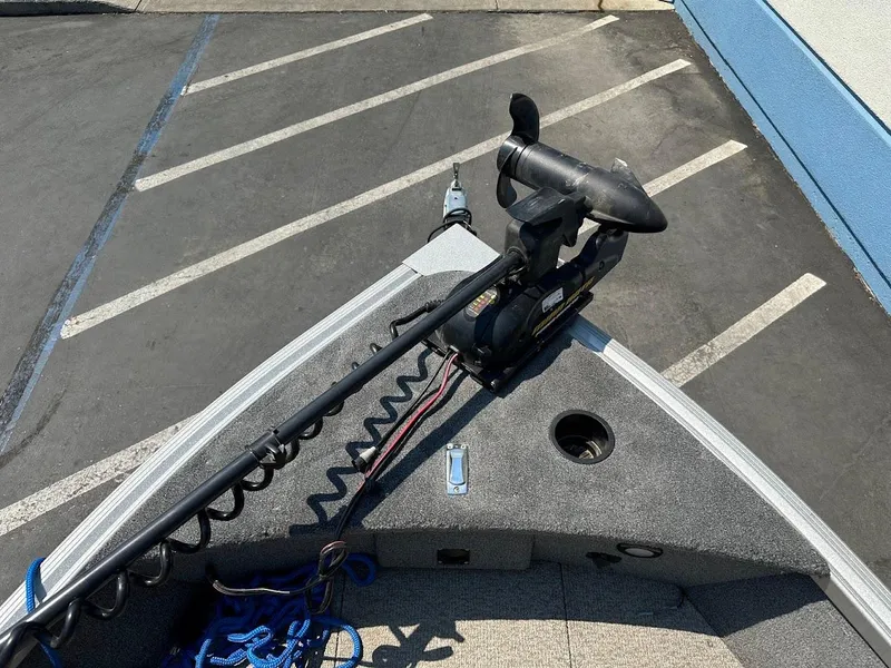 Slide: The Image of 2015 Alumacraft Competitor 165 Sport boat with trolling motor in parking lot. - 23