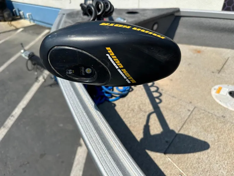 Slide: The Image of Minn Kota trolling motor on 2015 Alumacraft Competitor 165 Sport boat deck. - 24