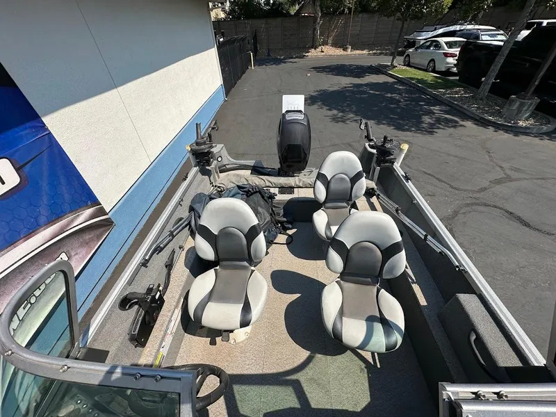 Slide: The Image of 2015 Alumacraft Competitor 165 Sport boat interior with seating and equipment. - 26