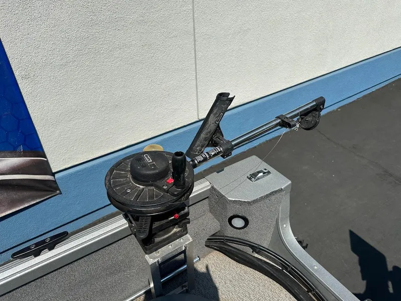 Slide: The Image of 2015 Alumacraft Competitor 165 Sport boat with fishing rod holder and reel setup. - 31