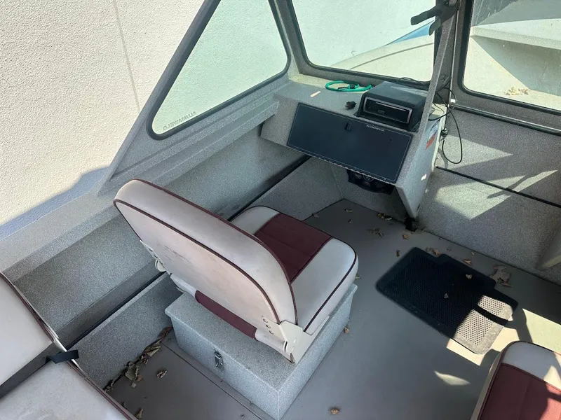 Slide: The Image of 2003 Alumaweld Stryker boat interior with seating and control panel. - 15