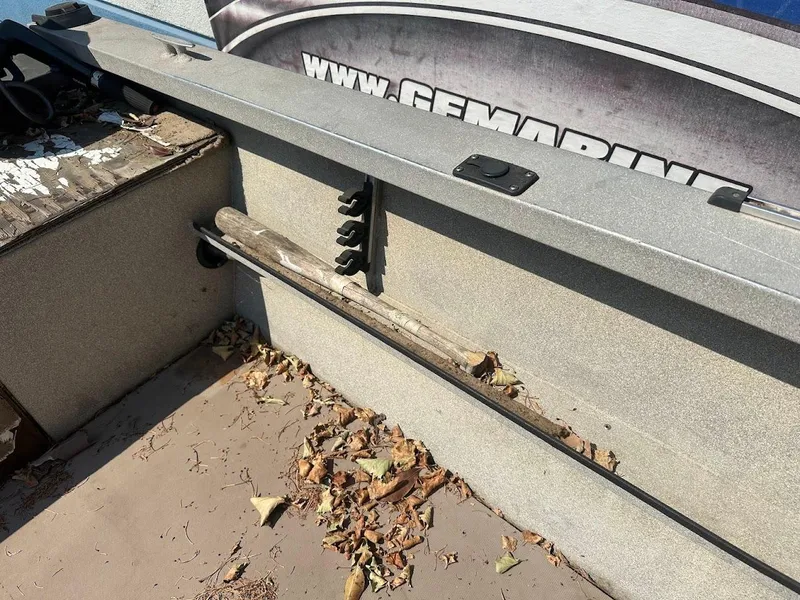 Slide: The Image of 2003 Alumaweld Stryker boat interior with leaves and fishing rod holder. - 22