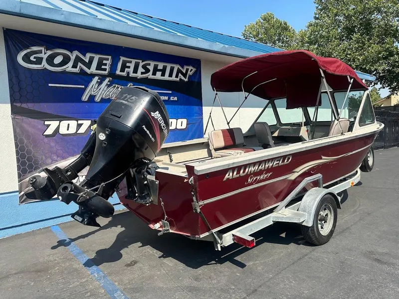 Slide: The Image of 2003 Alumaweld Stryker boat with Mercury outboard motor, parked at Gone Fishin' Marine. - 8