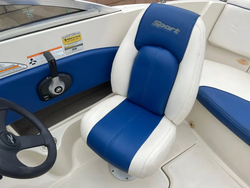 Slide: The Image of Blue and white seat in 2007 Sea Ray 185 Sport boat cockpit. - 11