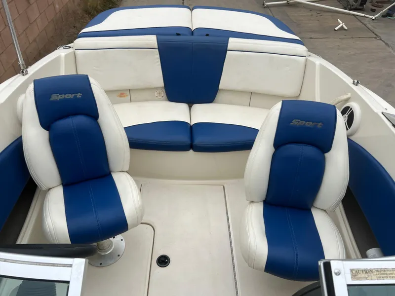 Slide: The Image of 2007 Sea Ray 185 Sport boat interior with blue and white seating. - 14