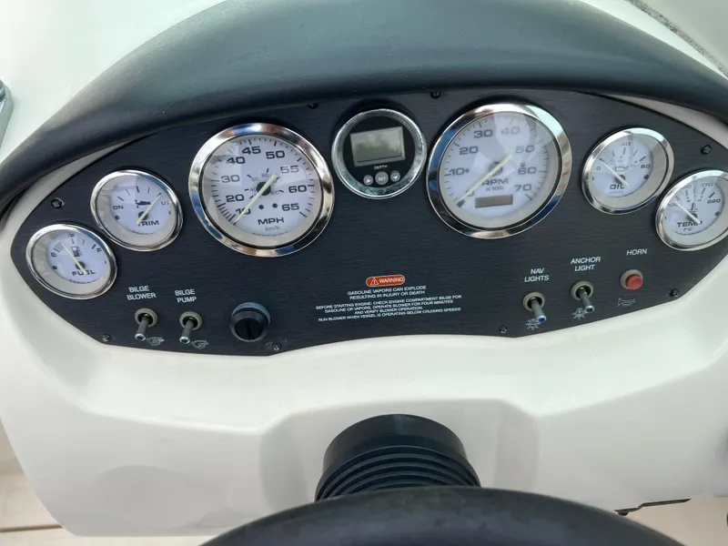 Slide: The Image of Dashboard of a 2007 Sea Ray 185 Sport boat with gauges and controls. - 15