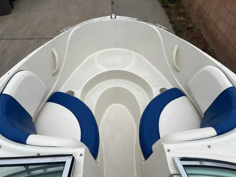 Slide: The Image of 2007 Sea Ray 185 Sport boat interior with blue and white seating. - 16