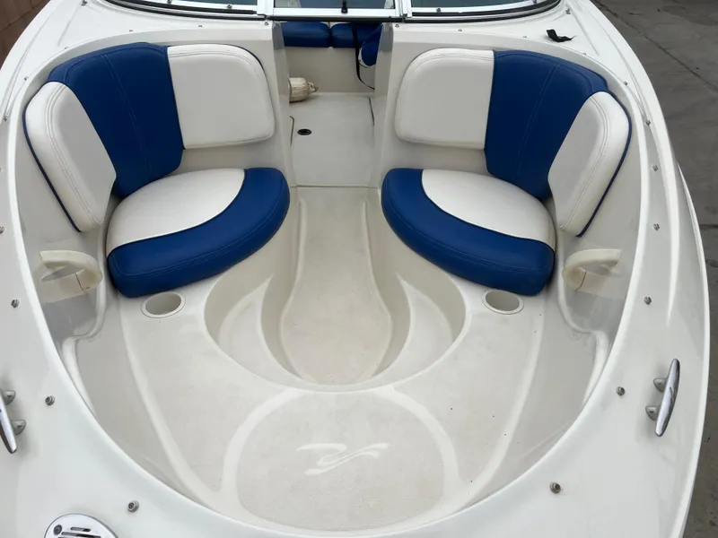 Slide: The Image of 2007 Sea Ray 185 Sport boat interior with blue and white seating. - 17