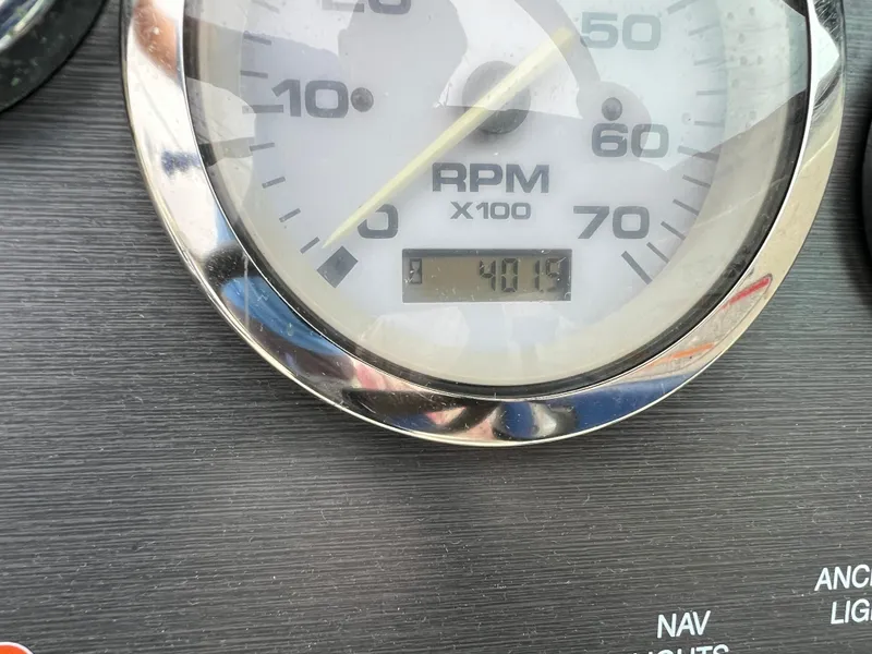 Slide: The Image of Close-up of 2007 Sea Ray 185 Sport RPM gauge displaying 401.9 hours. - 9