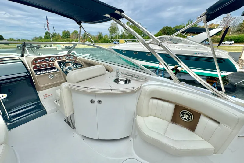 Slide: The Image of Interior of a 2008 Cobalt 323 boat with luxurious seating and control panel. - 10