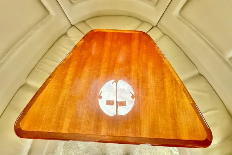 Slide: The Image of 2008 Cobalt 323 interior with wooden table and beige seating. - 21