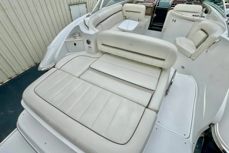 Slide: The Image of 2008 Cobalt 323 boat interior with white leather seating and modern dashboard. - 5