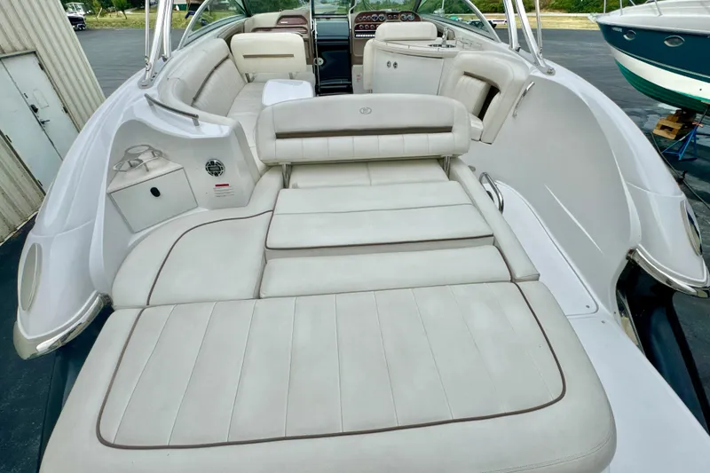 Slide: The Image of 2008 Cobalt 323 boat interior with spacious white leather seating and sunbathing area. - 6
