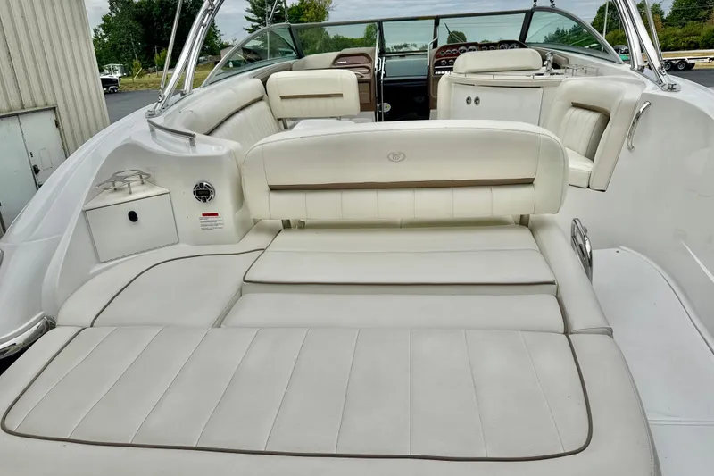 Slide: The Image of 2008 Cobalt 323 boat interior with white leather seating and sleek design. - 7