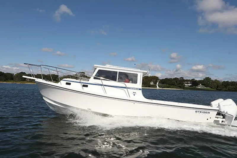 The Image of 2026 Steiger Craft 31 Fisherman boat cruising on a sunny day. - 1