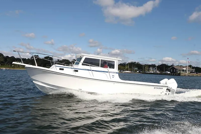 Slide: The Image of 2026 Steiger Craft 31 Fisherman boat cruising on a sunny day. - 10