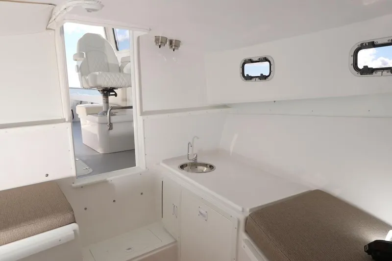 Slide: The Image of Interior of 2026 Steiger Craft 31 Fisherman boat with seating and compact sink area. - 11